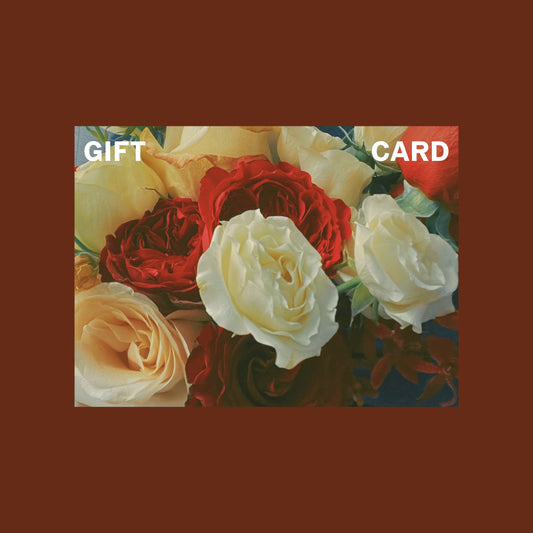 A gift card with white and red roses printed on it.